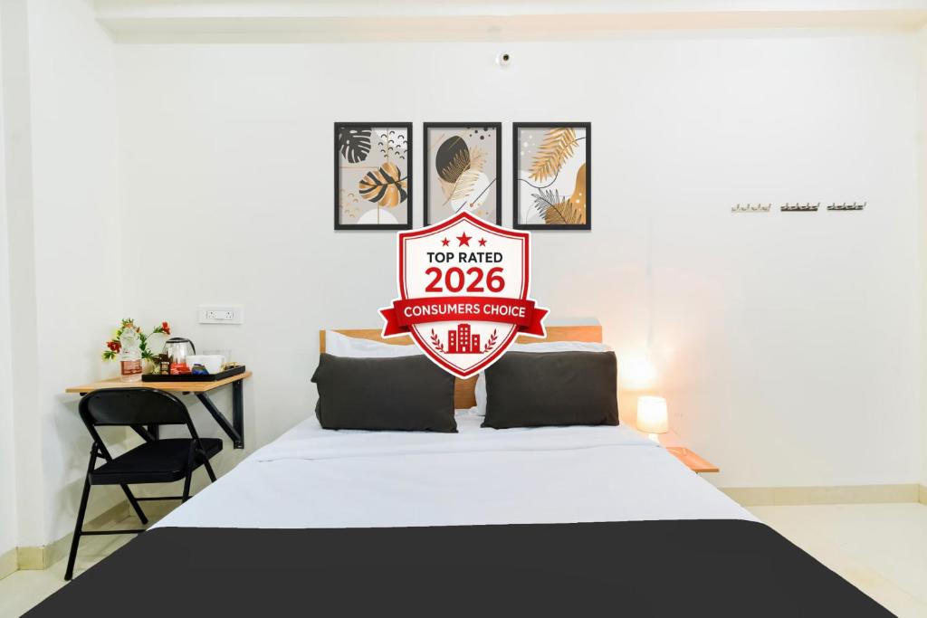 a room with a bed with a sign on it at Super Townhouse Kokapet Formerly Aarian Tej Nilayam in Hyderabad