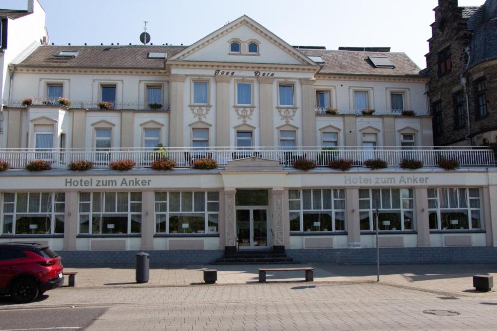 a building with a bench in front of it at Hotel zum Anker in Andernach