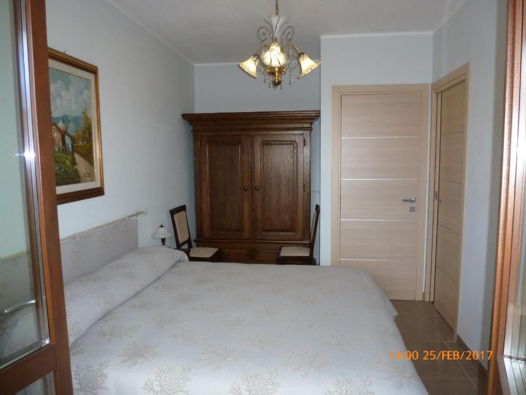 Łóżko lub łóżka w pokoju w obiekcie Sogno di mare