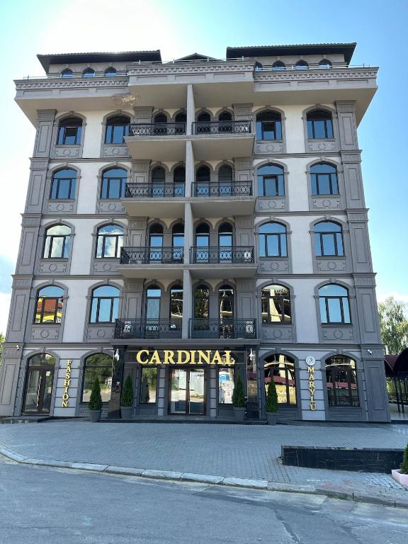 a large building with a car rental sign on it at Апарт-готель номер 303 in Truskavets