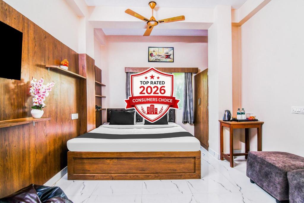 a bedroom with a bed with a sign on it at Super Hotel O Jessore Road Kolkata Formerly Skyline Serenity in Kolkata