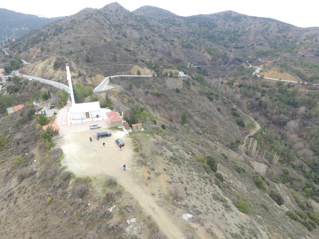 an aerial view of a windmill on a mountain at Christys Palace Hotel in Pedoulas