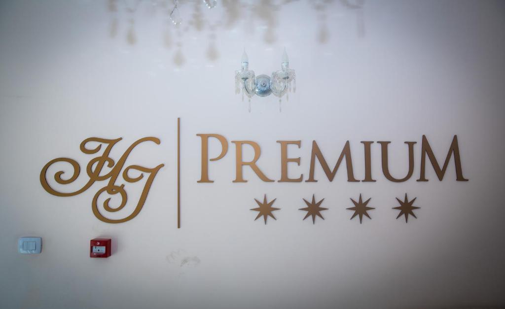 a white wall with a sign that says premier at Hotel Imperial Timisoara by JR in Timişoara