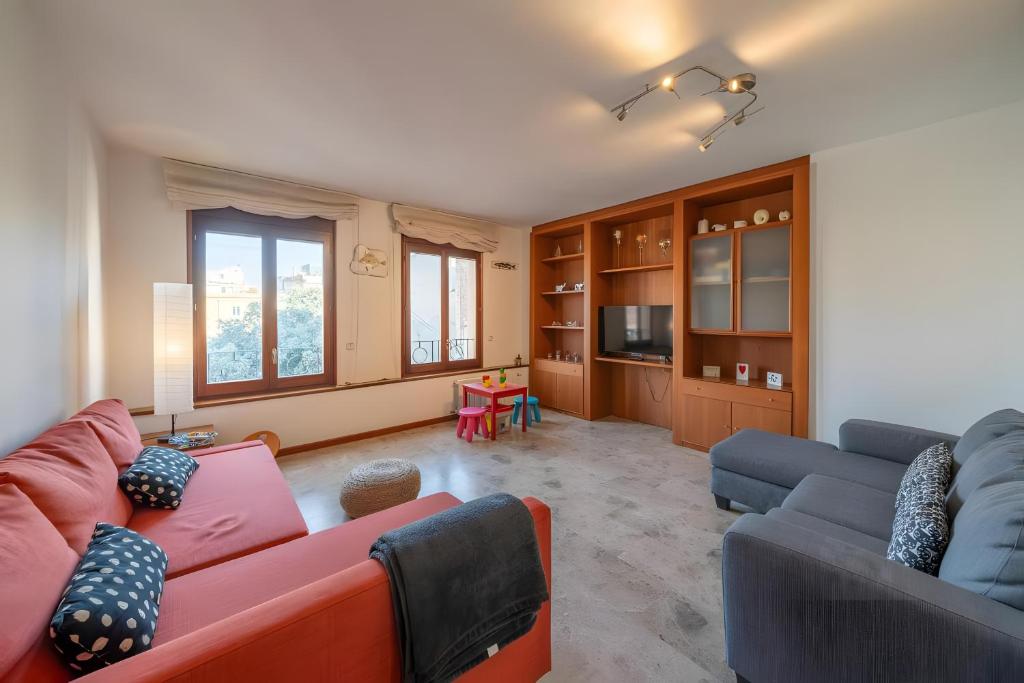 a living room with two couches and a tv at Can Jeroni in Figueres