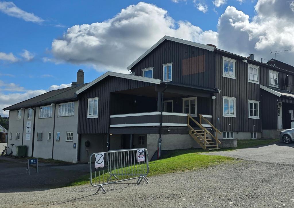 a large house with a sign in front of it at Idrettsparken in Røros