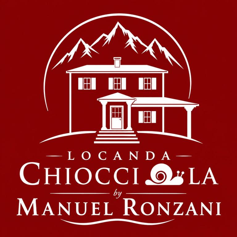 a logo for a restaurant in front of a mountain at Locanda Chiocciola By Manuel Ronzani in Quero