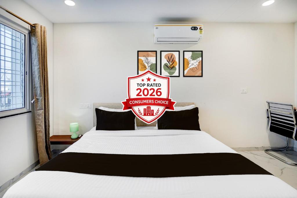 a room with a bed with a sign on it at Super Collection O Omkar Nagar Nagpur in Nagpur