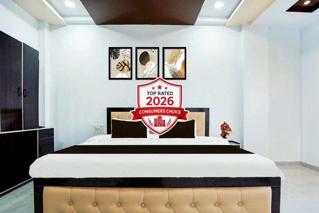 a bedroom with a bed with a sign on it at Super Hotel O Dabha Hilltop in Nagpur