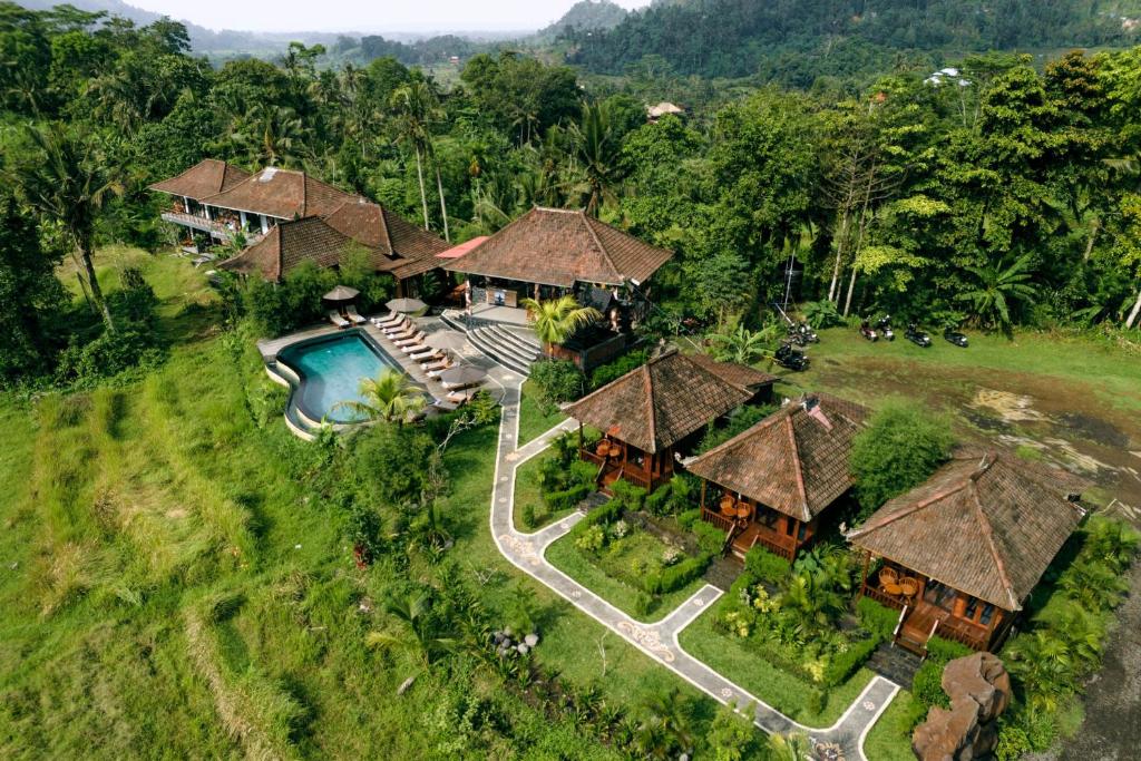 an aerial view of a resort with a swimming pool at Cassowary Villas Sidemen by AGATA in Sidemen