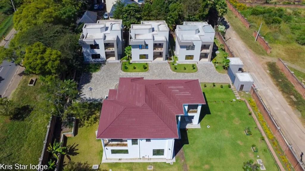 an overhead view of a house with a red roof at Kris Star Lodge in Blantyre