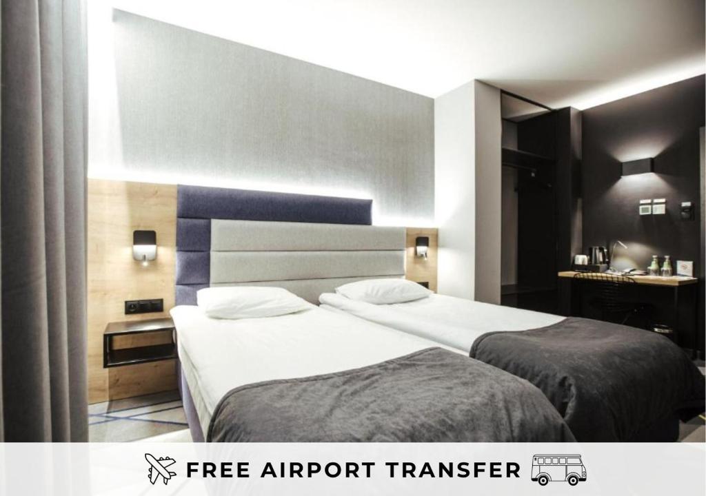 En eller flere senge i et værelse på Air Hotel