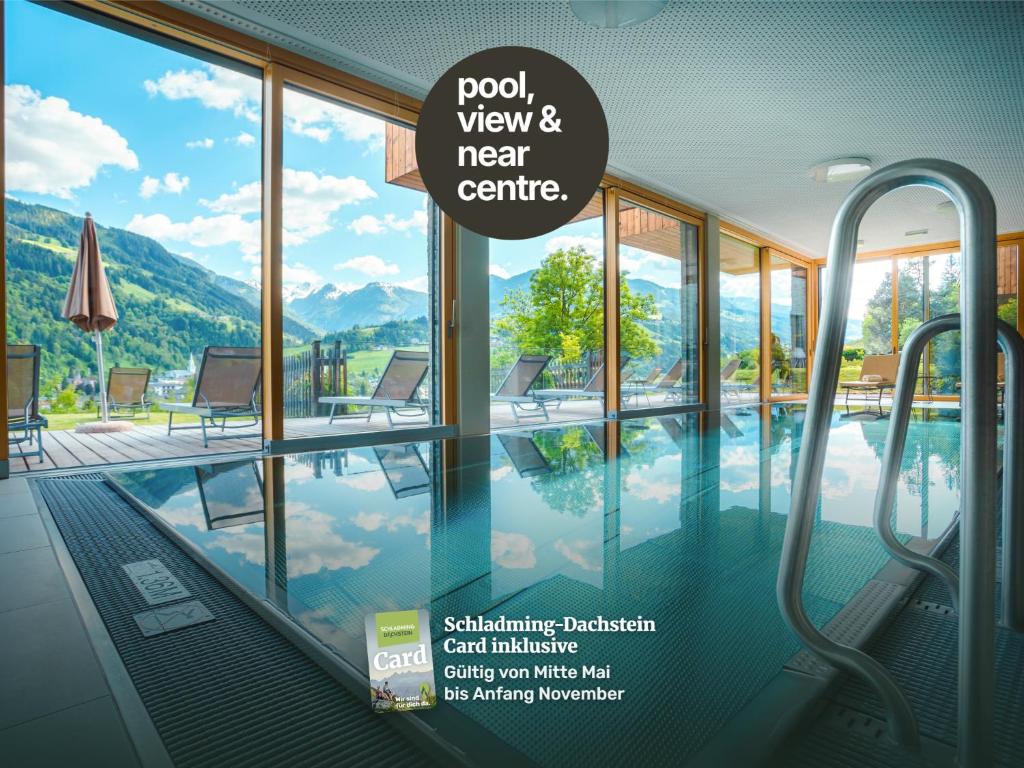 a swimming pool with a sign that reads pool view and near centre at Sun Lodge Schladming by Schladming-Appartements in Schladming