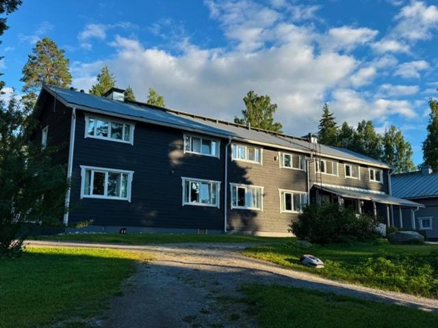 a large house with a driveway in front of it at Norppa Lake Resort in Savonlinna