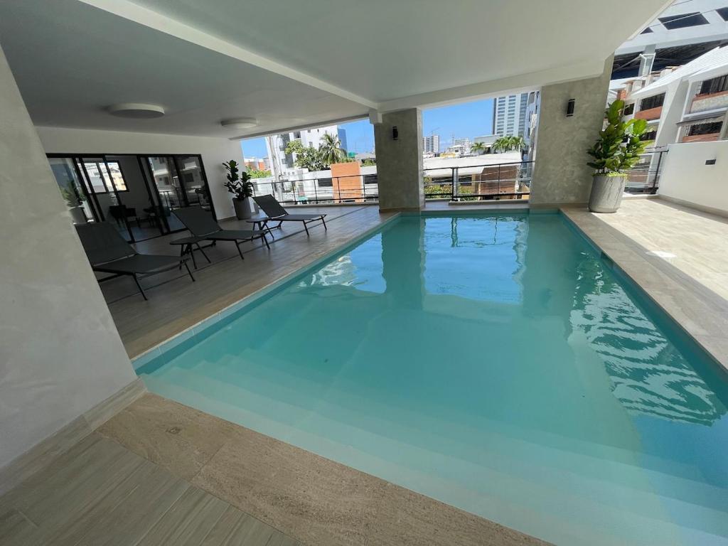 a swimming pool on the roof of a building at Furnished two-bedroom apartment DN in Solorín