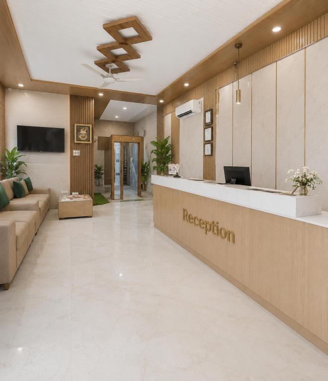 a reception area of a hospital with a reception desk at Hotel Arnul Plaza in Faizābād