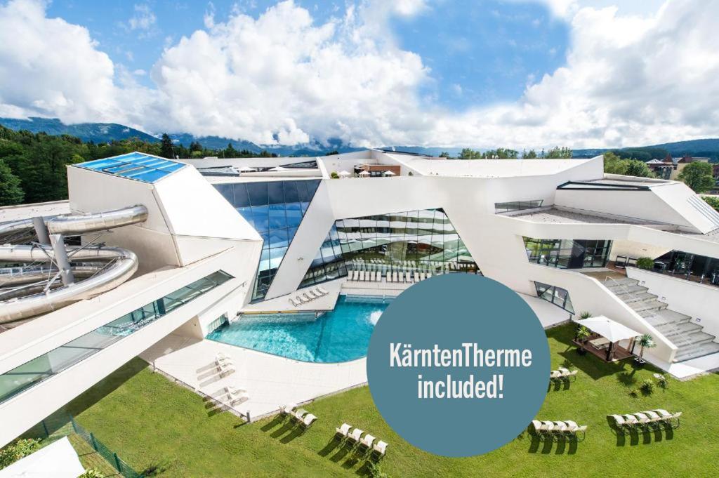 a rendering of a building with a swimming pool at Hotel Karawankenhof in Villach
