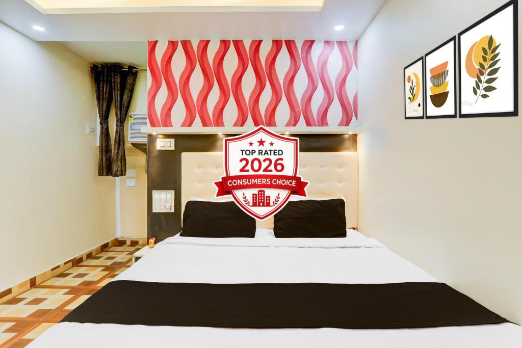 a bedroom with a bed with a sign that reads at Collection O Jagdeo Path Patna in Patna