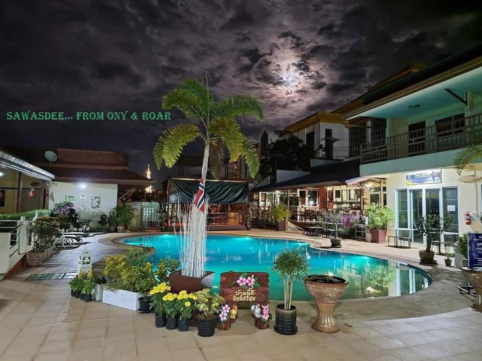 a pool with a fountain in the middle of a building at Baan Sabaijai Resort in That Phanom