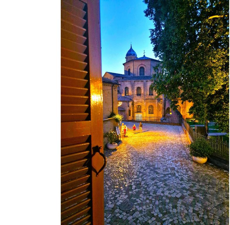 a view from a door of a building at night at DOMUS GALLA PLACIDIA - superlative view - 50 meters from UNESCO heritage sites - San Vitale - Galla Placidia in Ravenna