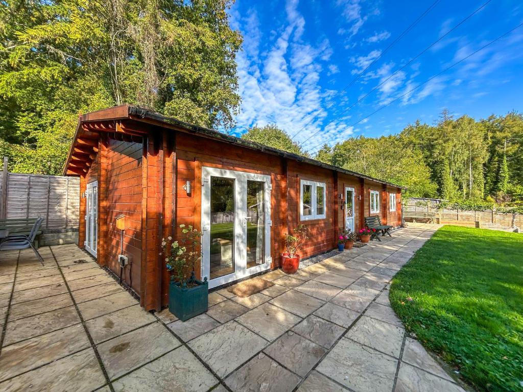 a tiny house is sitting on a patio at The Cabin in Sevenoaks