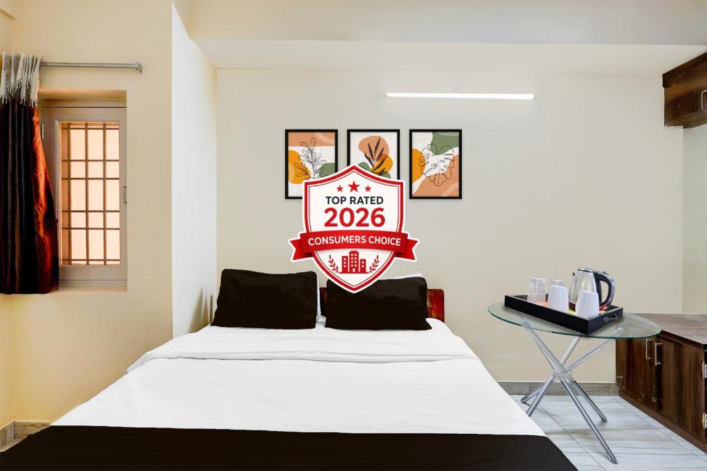 a room with a bed with a sign on it at Super Collection O Vellore Near CMC Hospital Formerly Geetha Residency in Vellore