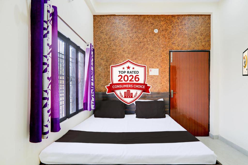 a room with a sign that reads cure at Super Hotel O Sudhirpur near Phonix Hospital in Varanasi