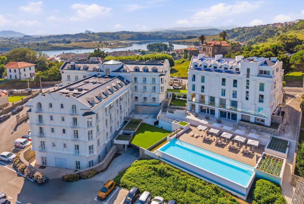 an aerial view of a building and a pool at Gran Hotel Suances Suites in Suances