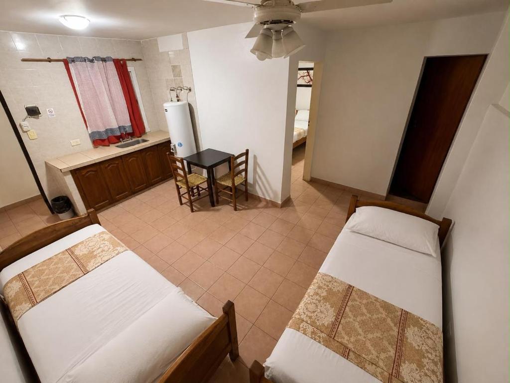 A bed or beds in a room at Borus Hotel