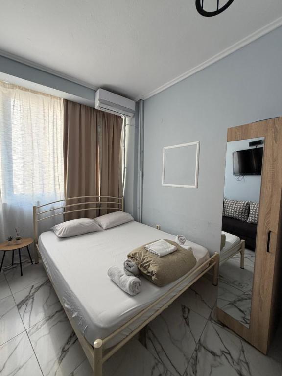 a bedroom with a bed in a room at Athanias Studio II in Drama