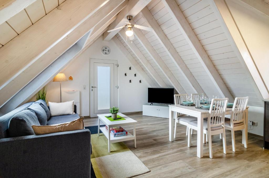 a living room with a couch and a table at Appartment Naturblick in Stockach