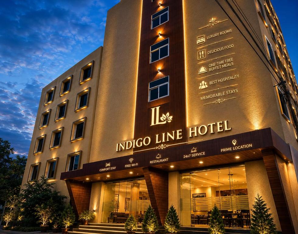 an indigo line hotel is lit up at night at IndiGo Line Hotel - Opp Paradise Biryani Shamshabad in Hyderabad