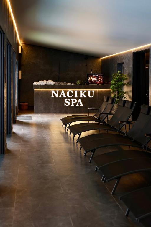 a row of chairs in the lobby of a spa at NACHIKU Bukovel Resort & SPA in Palyanytsya
