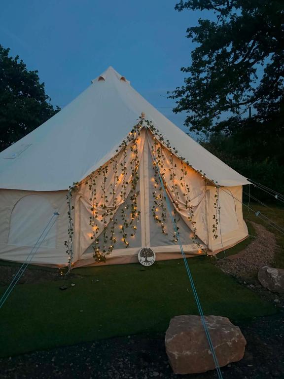 a tent with christmas lights on it at Woodview Caravan Site in Church Leigh