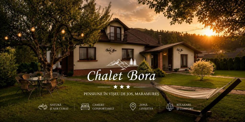 a house with a sign that reads chicken bonanza at Chalet Bora in Vişeu de Jos