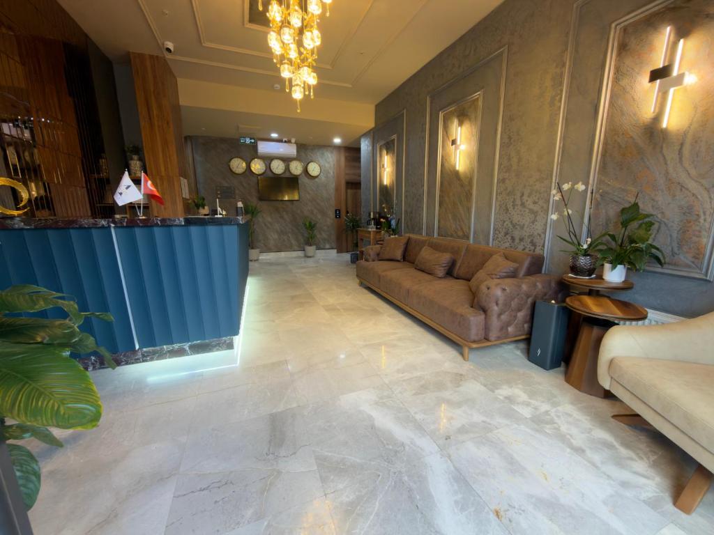 a living room with a couch and a table at Alabi Hotels in Istanbul