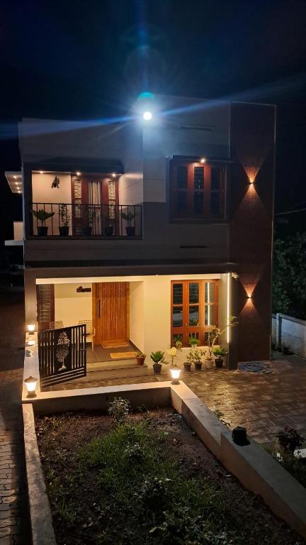 a house with a light on top of it at night at Kodikkakkam Homestay in Kappil