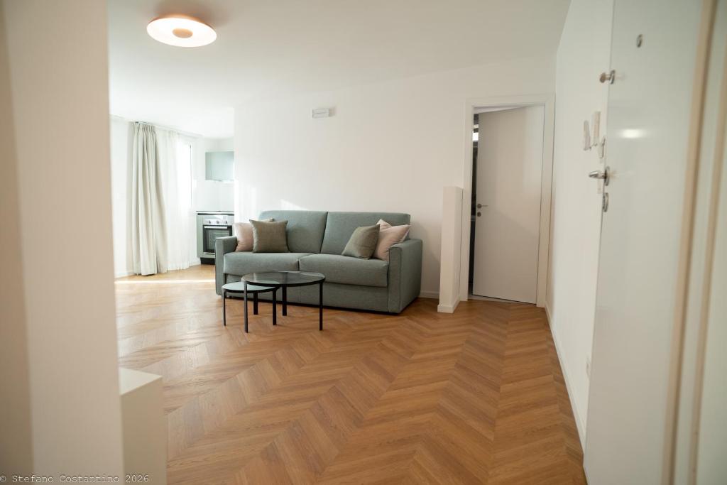 a living room with a couch and a table at Appartamento Costanza in Letojanni