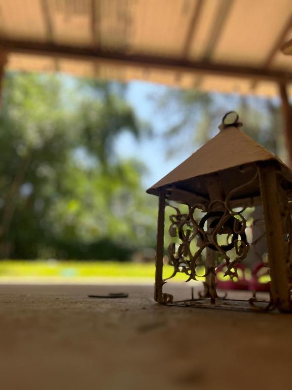 a small metal object sitting on the ground at Apart Santa Ana in Santa Ana
