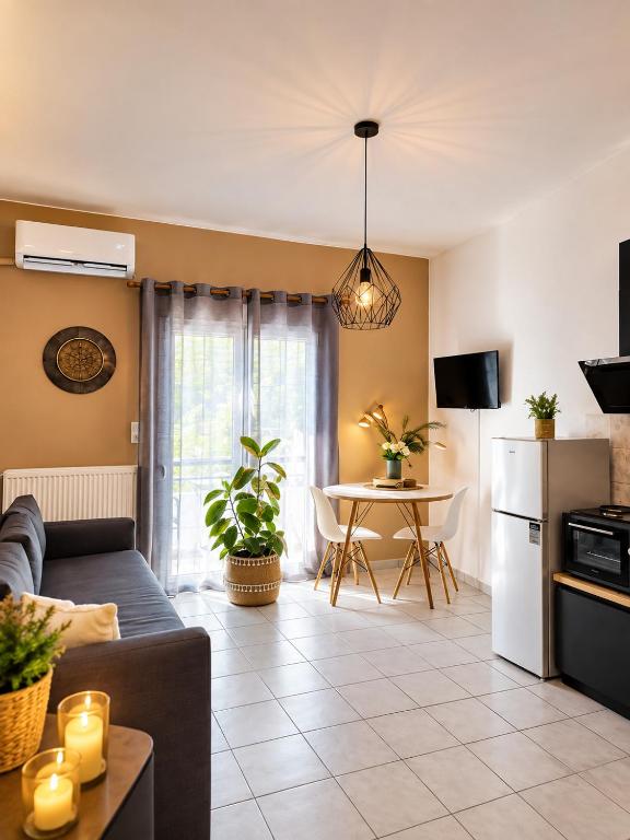 a living room with a couch and a table at Home Volos in Volos