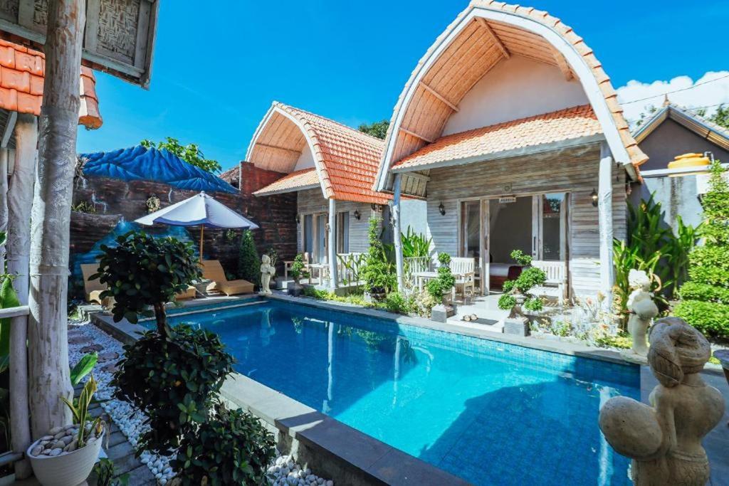 an image of a house with a swimming pool at The Box Paradise Bungalow in Nusa Penida