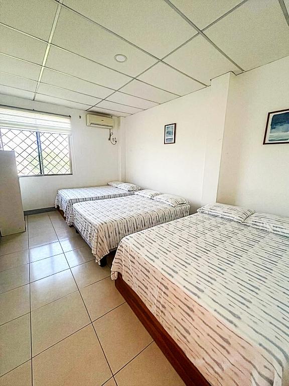 Lova arba lovos apgyvendinimo įstaigoje Pargo, habitación privada de Flor de Lis Beach House