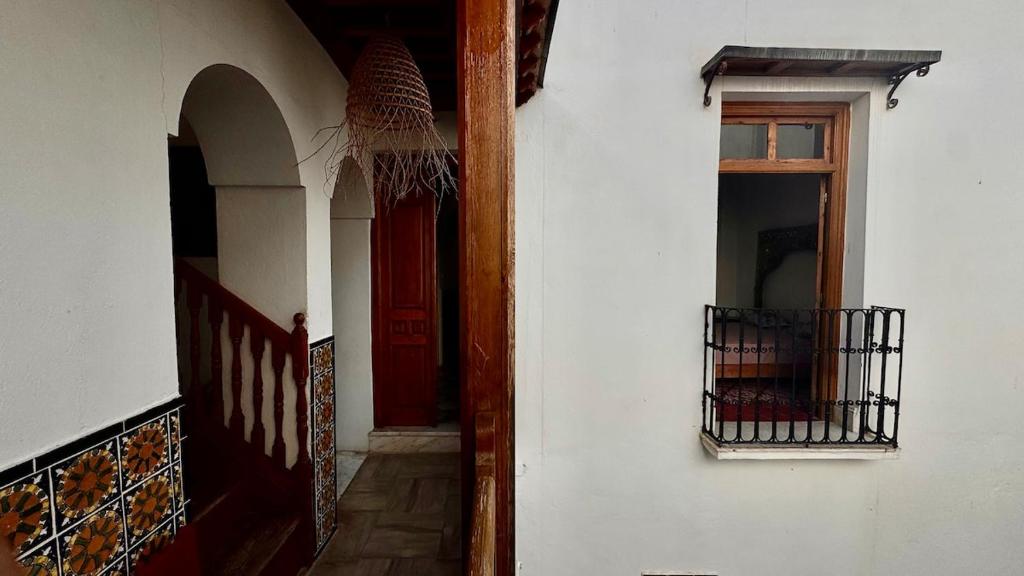 an entrance to a building with a red door at bayt el yemin in Kasbah