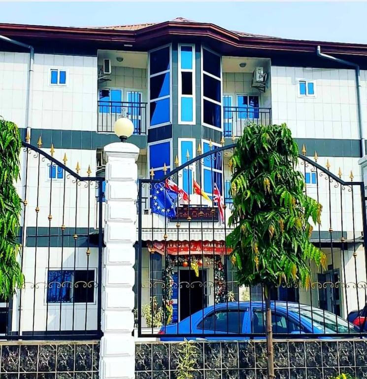 a building with a fire escape on the side of it at Hotel Omnisport in Limbe