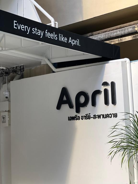 a sign for an april sign for a car dealership at April Ari-Saphankhwai in Bangkok