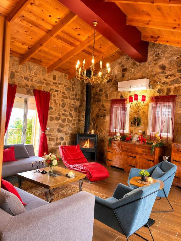a living room with a couch and a table at chalet de paradis in Bizerte