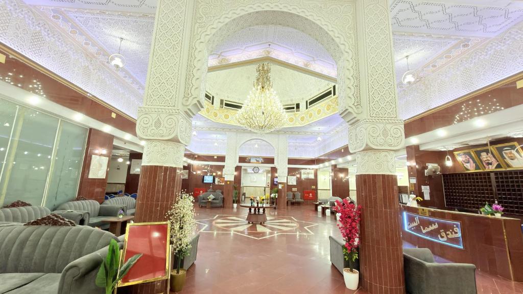 a lobby of a hotel with a chandelier at Sama Al Bayt in Mecca
