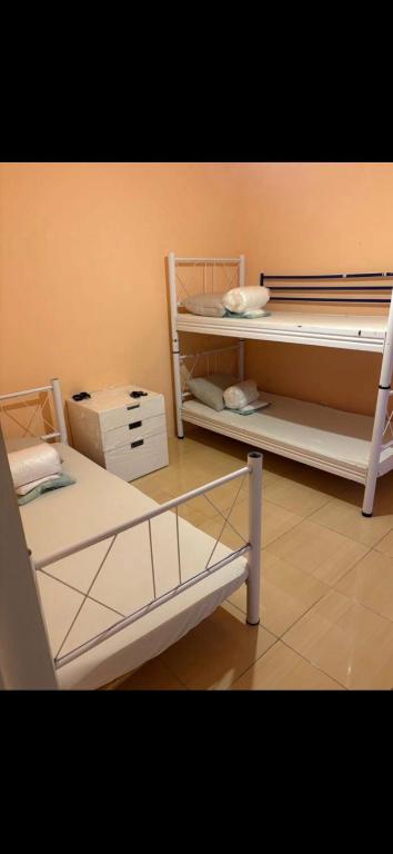a room with two bunk beds in a room at Welcome Home in Piaseczno