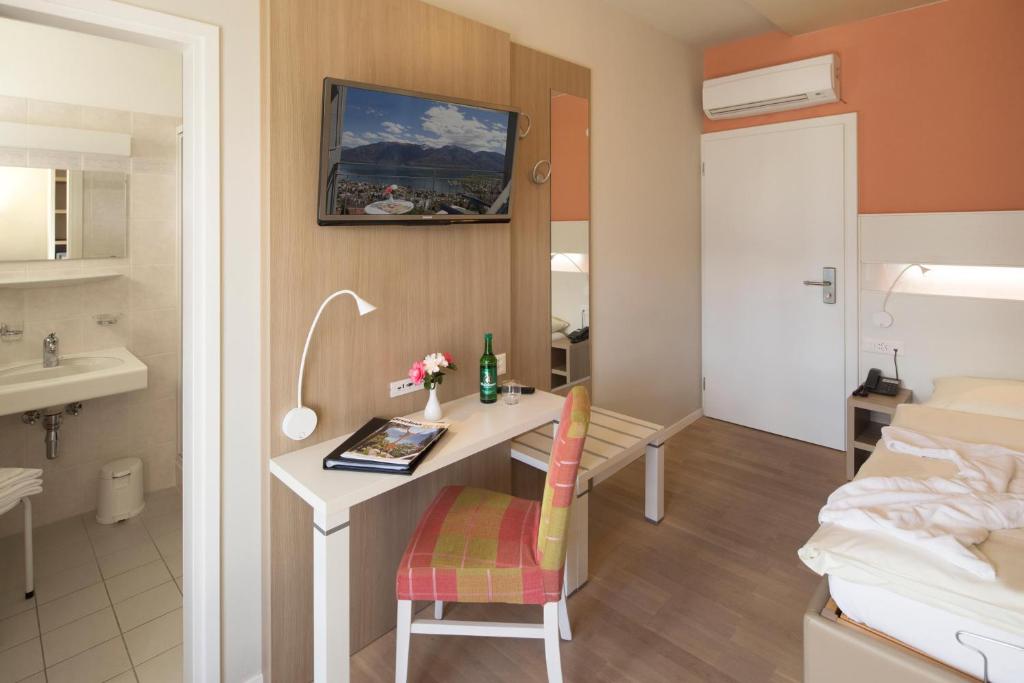 TV a/nebo společenská místnost v ubytování Hotel Stella SA