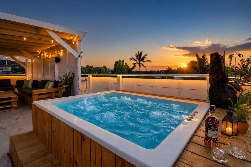 a hot tub sitting on top of a patio at Casa roof in Las Terrenas