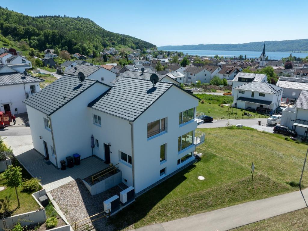 an aerial view of a white house at Ferienhaus Aura in Bodman-Ludwigshafen